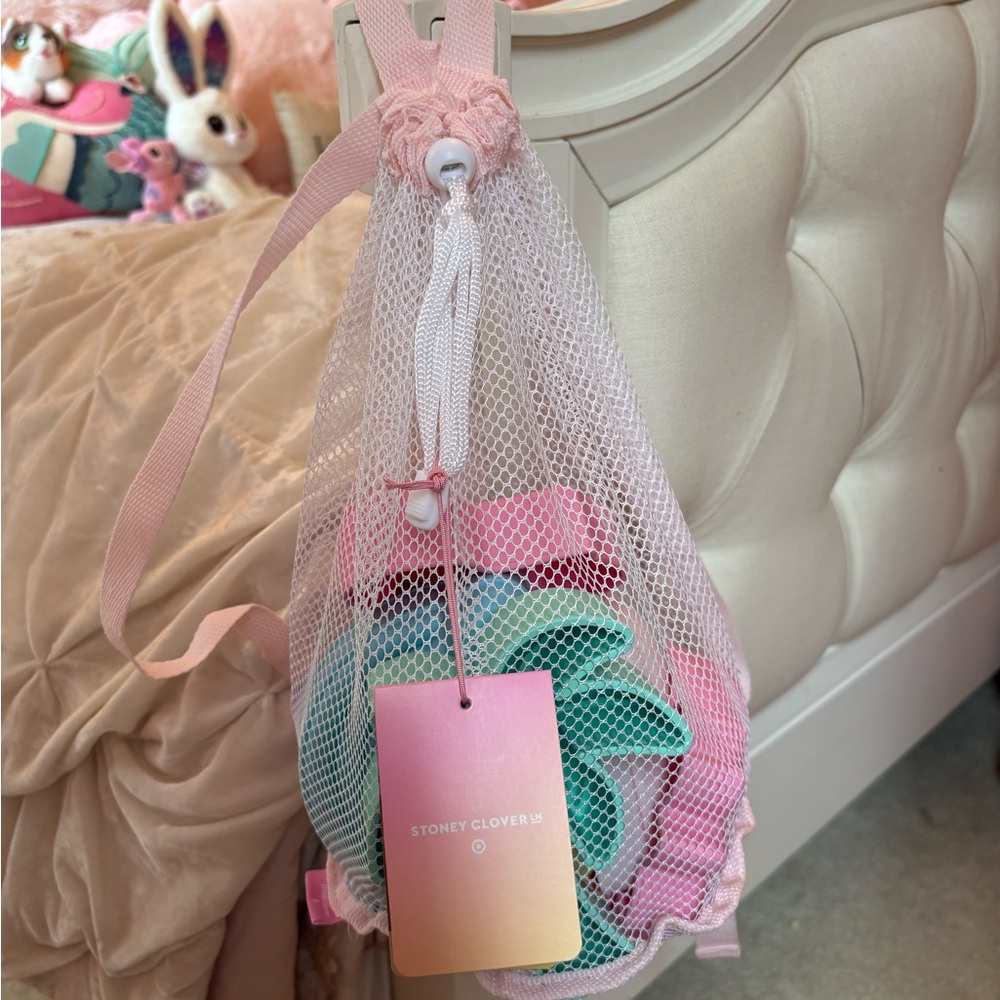 Stoney Clover Lane Pink and White Mesh Drawstring Bag with beach toys